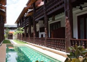 A swimming pool in the middle of the garden area